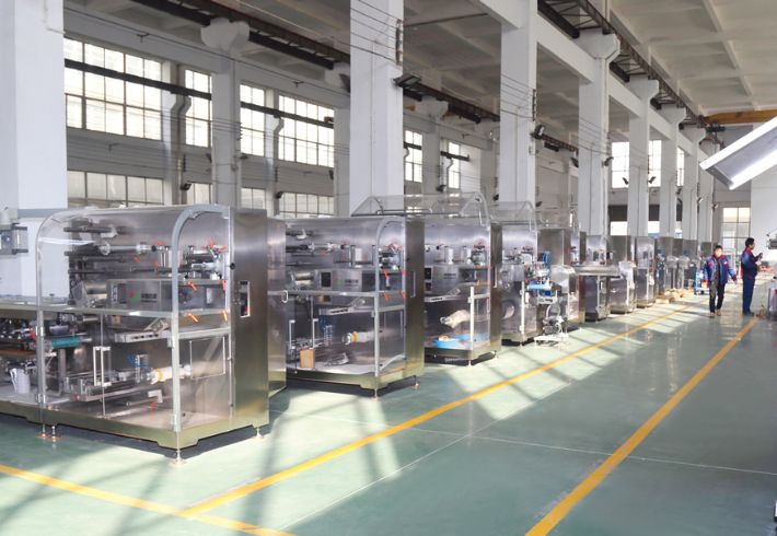 Industrial Packaging Machinery In A Modern Factory Setting