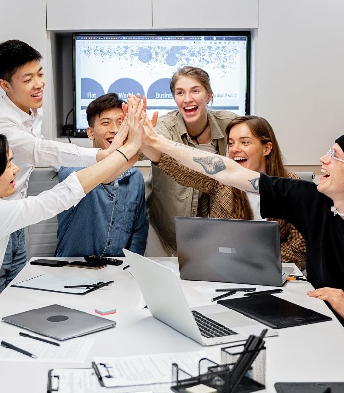 A Professional And Friendly Team Collaborating In A Modern Office